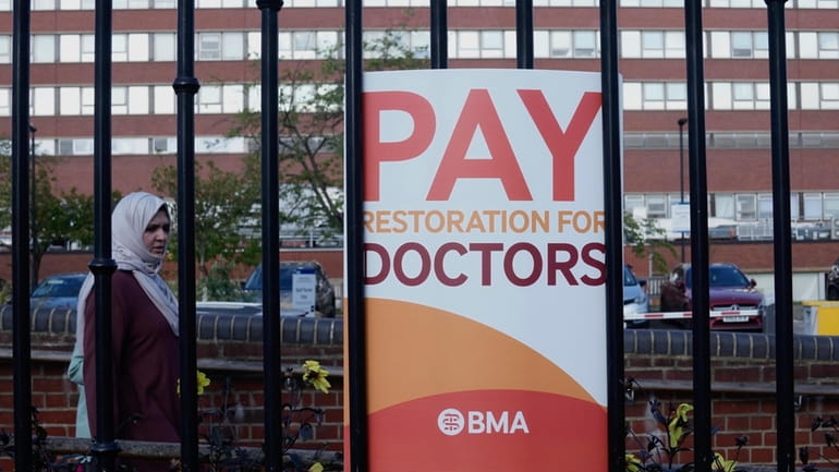A placard from the BMA (British Medical Association) is displayed...