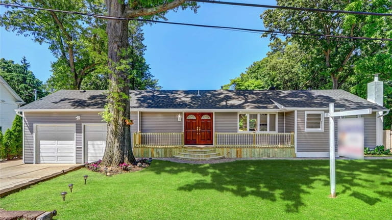 Priced at $649,000, this expanded ranch on Roxbury Street is...