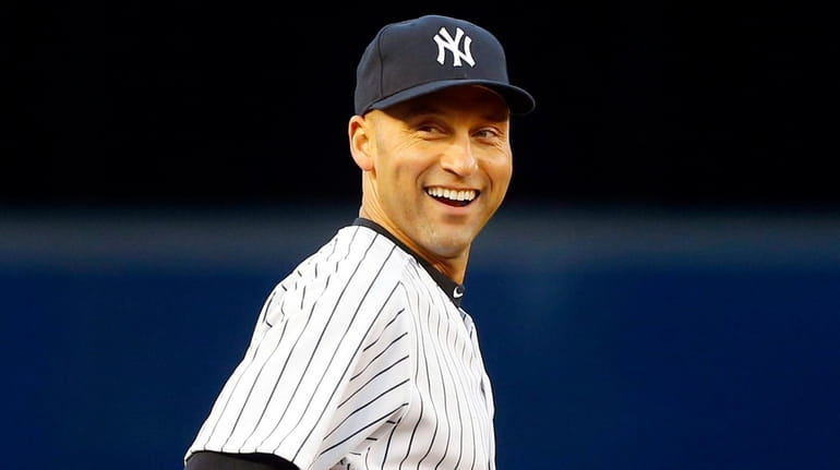 Derek Jeter of the Yankees looks on before a game...