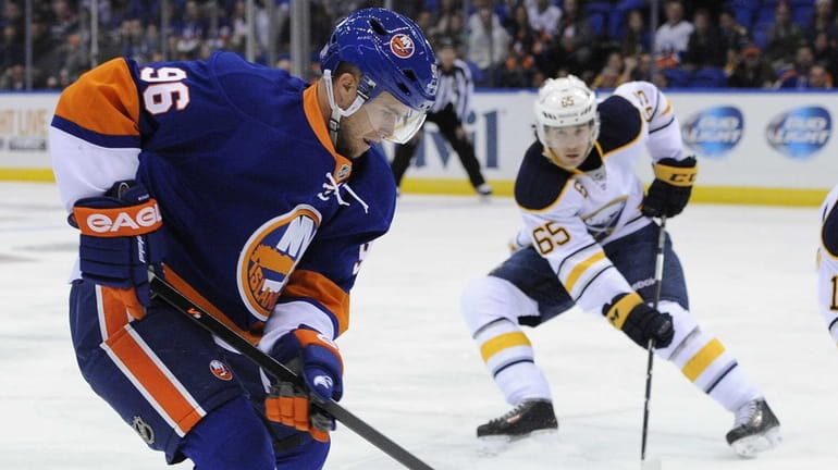 Islanders' Pierre-Marc Bouchard skates against the Buffalo Sabres in the...