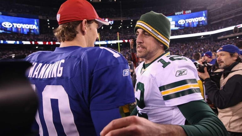 Eli Manning congratulates Aaron Rodgers after the Packers won 38-35...