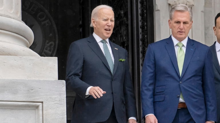 President Joe Biden talks with House Speaker Kevin McCarthy, R-Calif.,...