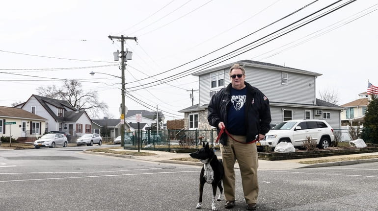 Island Park Mayor Michael McGinty with his dog Cassie at Deal and...