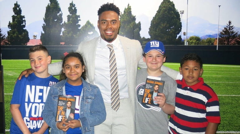 Former Giants running back and author Rashad Jennings with Kidsday...
