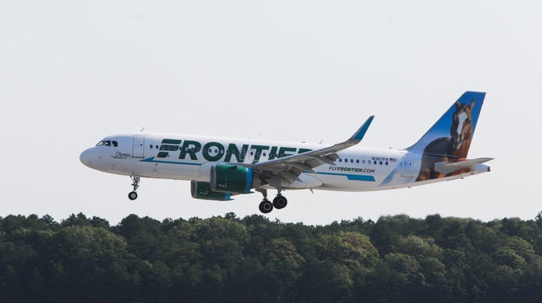 A Frontier Airlines plane lands at Long Island MacArthur Airport...
