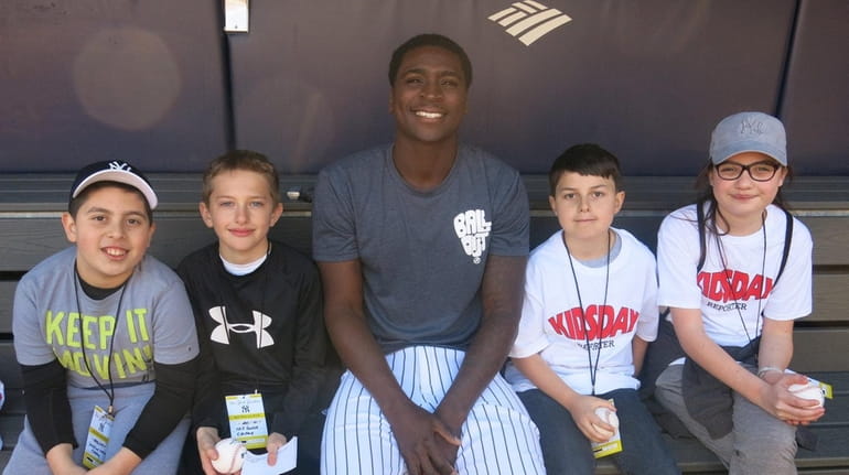 Yankees shortstop Didi Gregorius with Kidsday reporters, from left, Sebastian...