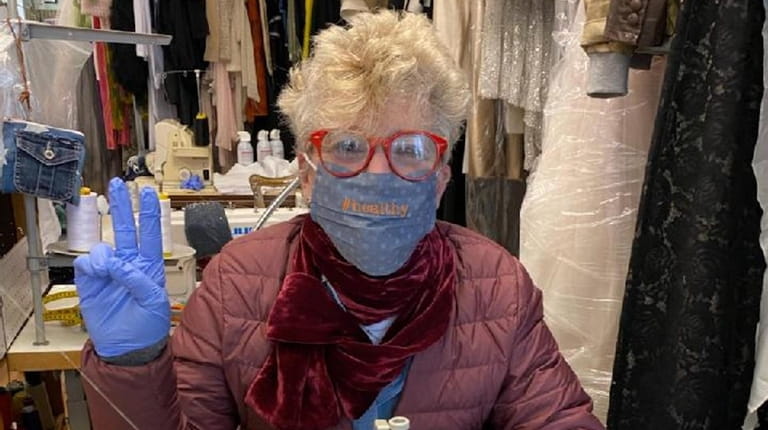 Nancy Sinoway, a Port Washington dressmaker, makes surgical-style masks at...