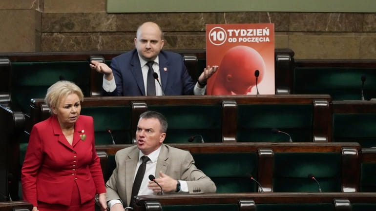 Dariusz Matecki, a conservative lawmaker in the Polish parliament, displays...