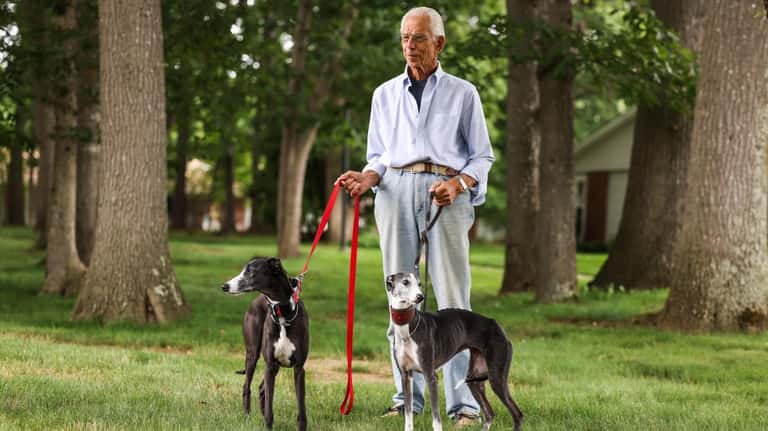 Meschkow with his son's whippet, CJ, left, and his own, Zara.
