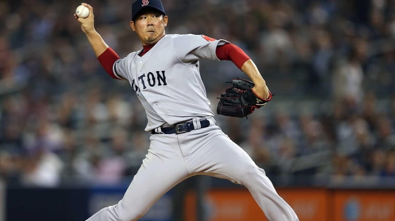 Boston Red Sox pitcher Daisuke Matsuzaka delivers a pitch during...