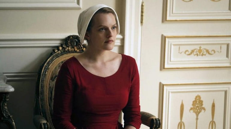 Elisabeth Moss as Offred, in a scene from "The Handmaid's...