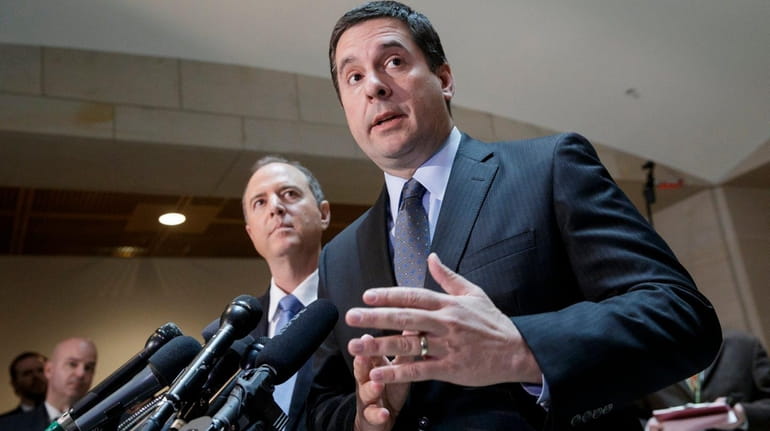 House Intelligence Committee Chairman Rep. Devin Nunes, R-Calif., right, accompanied...