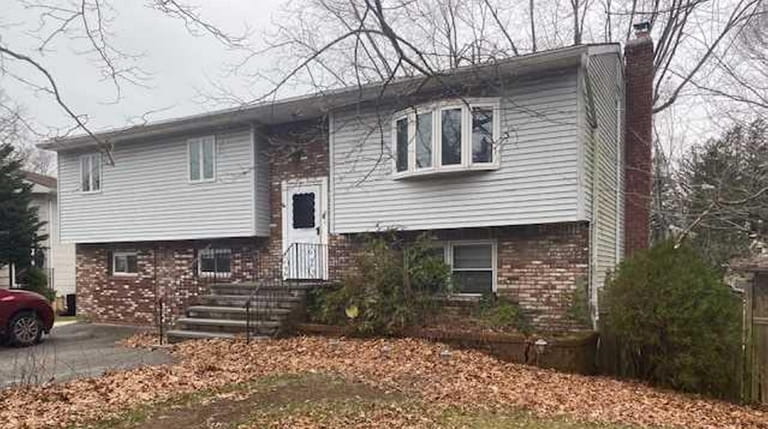 Priced at $325,000 and located on Pine Avenue in Ronkonkoma,...