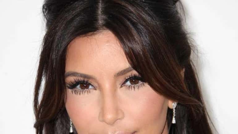 Kim Kardashian arrives at the 20th Annual Elton John AIDS...
