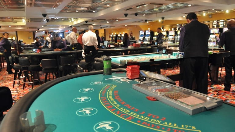 Some of the gaming tables aboard the Escapade, a luxury...
