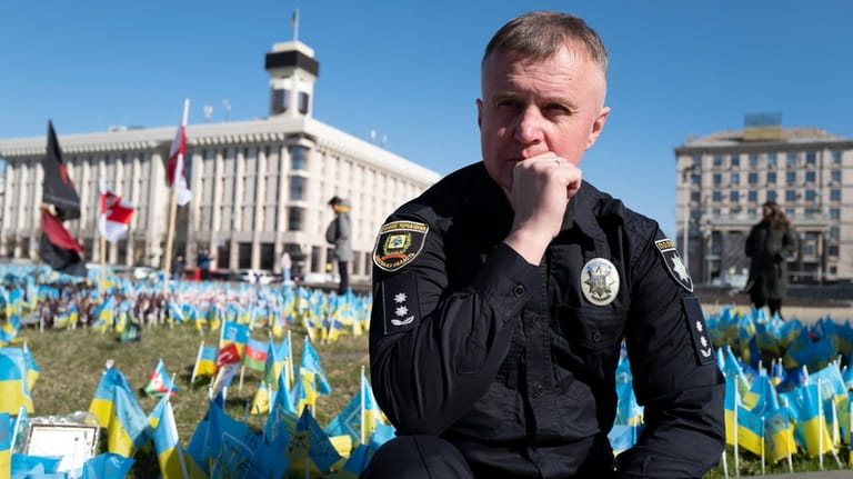 Ukrainian police officer Volodymyr Nikulin poses for a photo in...