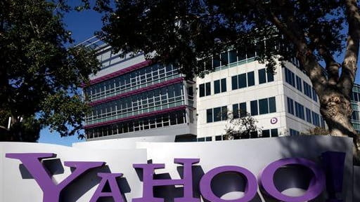 The Yahoo! logo is seen in front of the company's...