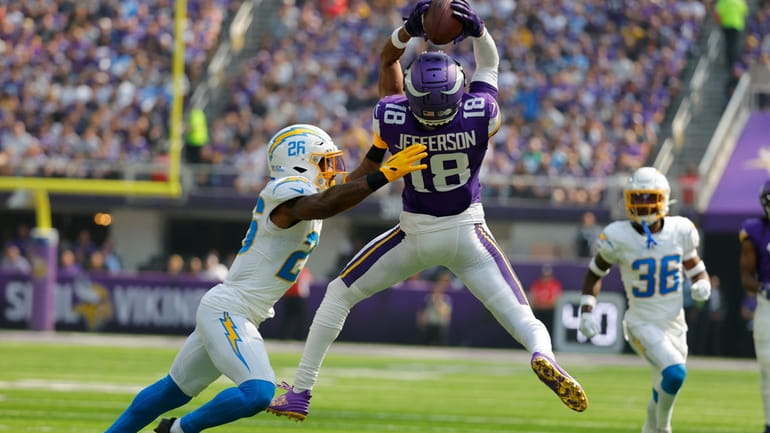 Minnesota Vikings wide receiver Justin Jefferson (18) catches a pass...