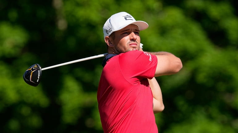 Bryson DeChambeau hits from the 18th tee during the second...