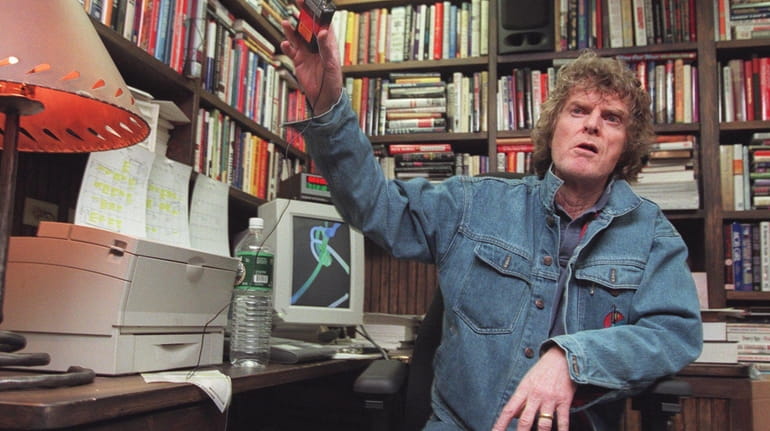 Don Imus removes a wireless microphone following his nationally syndicated...