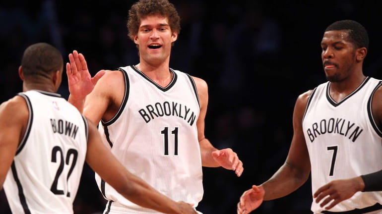 Brooklyn Nets center Brook Lopez #11 high0fives shooting guard Markel...