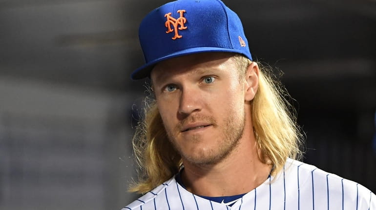 New York Mets pitcher Noah Syndergaard looks on from the...