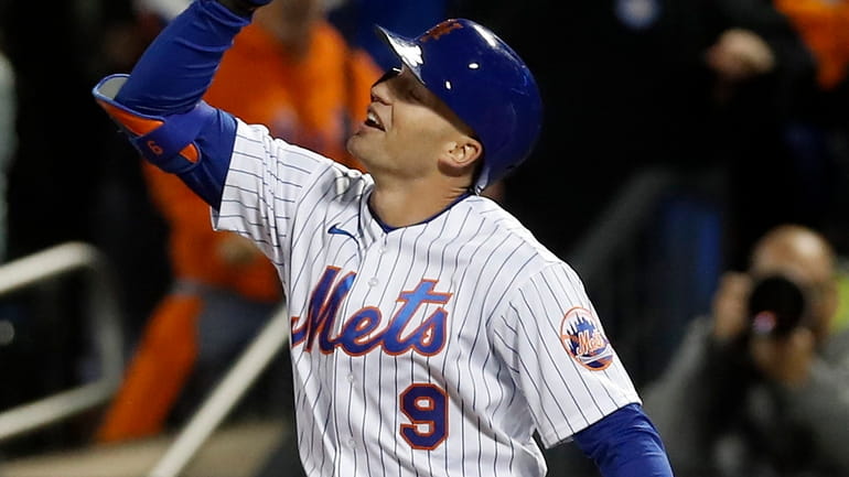 Brandon Nimmo of the Mets reacts at first base after his...