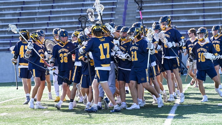 Northport players celebrate 13-9 win against Scarsdale during the  New...