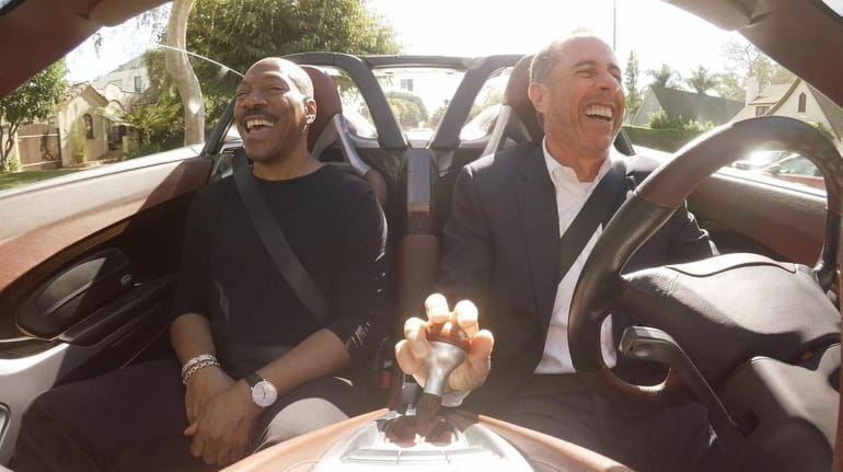 Eddie Murphy, left, and Jerry Seinfeld have a drive to...