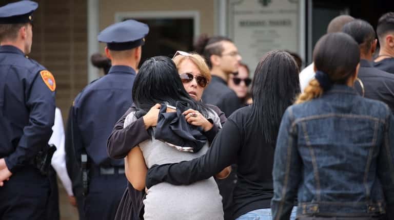 Mourners arrive for the funeral of Evelyn Rodriguez at St....