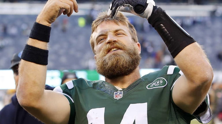 Ryan Fitzpatrick #14 of the New York Jets reacts after...