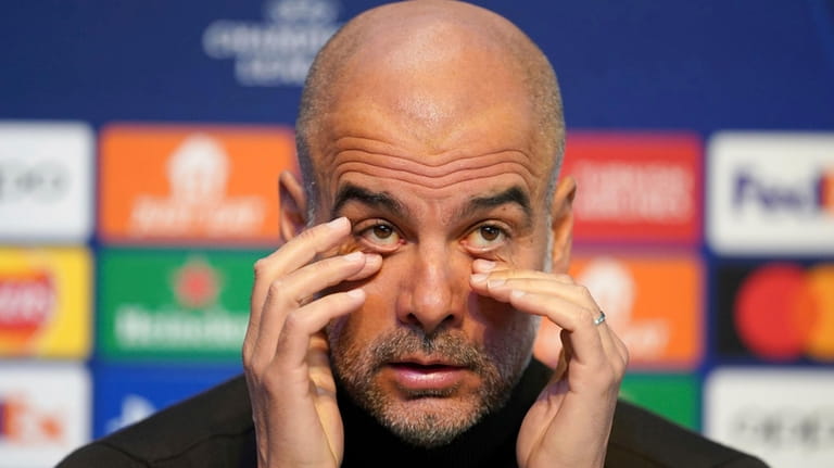 Manchester City manager Pep Guardiola reacts during a press conference...