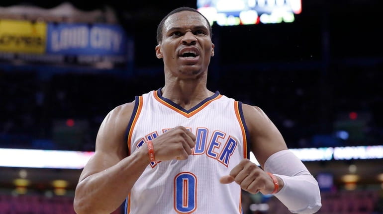 Thunder guard Russell Westbrook reacts after scoring against the Heat...