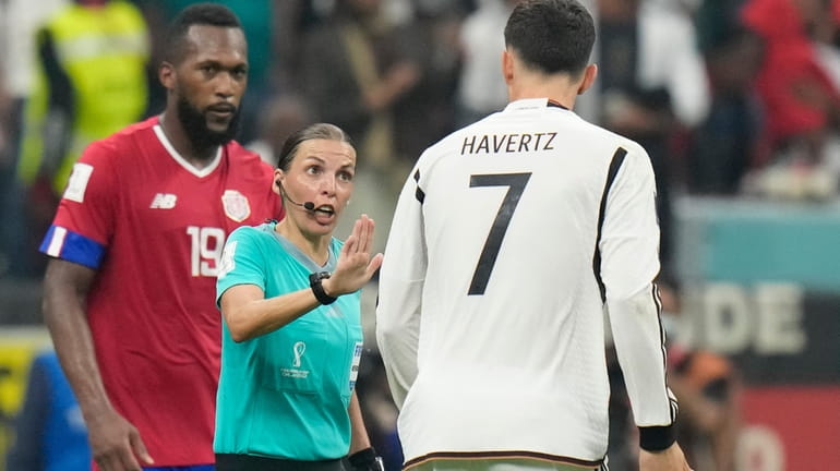 FILE - Referee Stephanie Frappart talks with Germany's Kai Havertz...