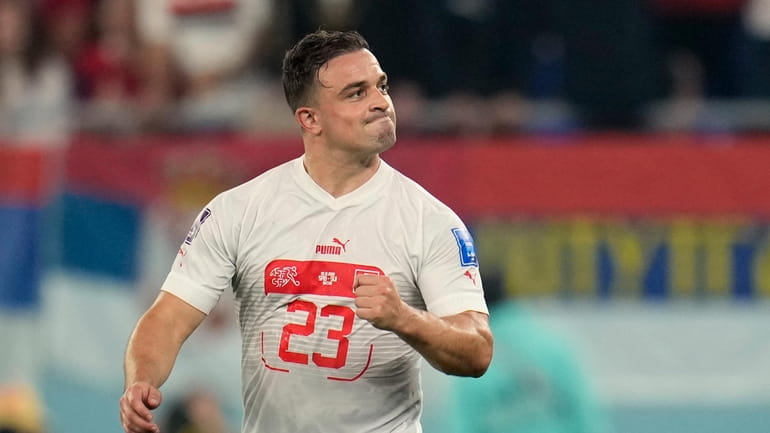 Switzerland's Xherdan Shaqiri celebrates after scoring his side's first goal...