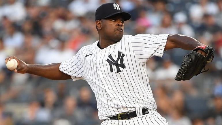 Yankees starting pitcher Luis Severino delivers against the Reds during...
