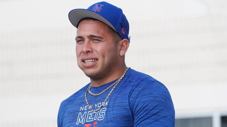 New York Mets minor league catcher Francisco Alvarez talks to...