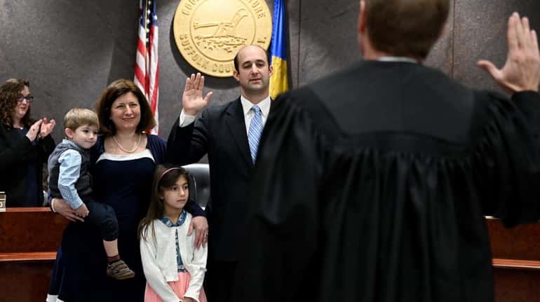 Robert Calarco (D-Patchogue) is sworn in as presiding officer of the Suffolk...
