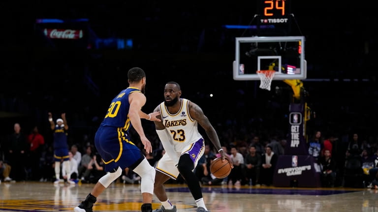 Los Angeles Lakers forward LeBron James (23) looks up at...