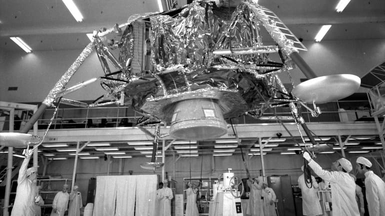 Grumman technicians help build the Apollo lunar module in 1969....