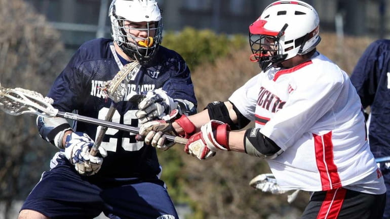 Floral Park's Andrew Viola, right, scores as New Hyde Park's...