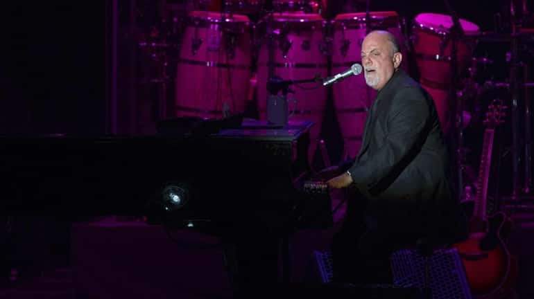 Billy Joel and his band take the stage at the...