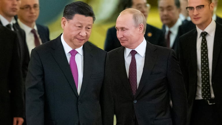 Chinese President Xi Jinping, left, and Russian President Vladimir Putin...