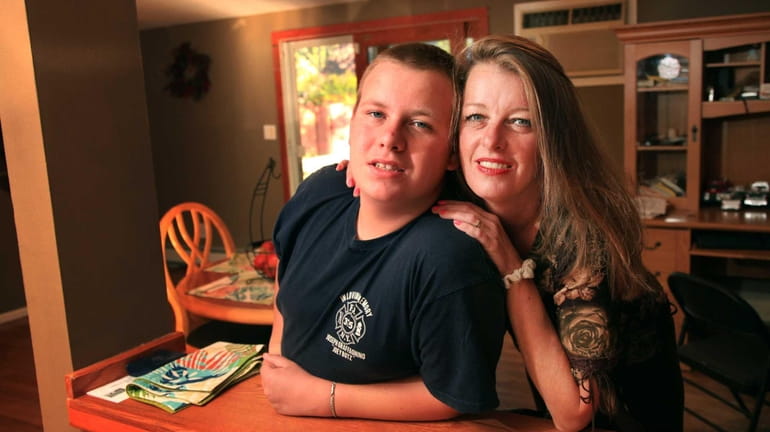 Carol Scanlan and her son, Bill, 14, in their Holbrook...