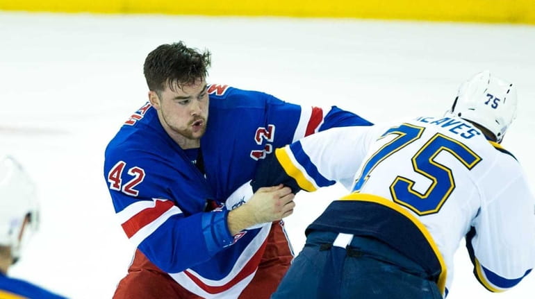 New York Rangers Dylan McIlrath (42) fights with St. Louis...