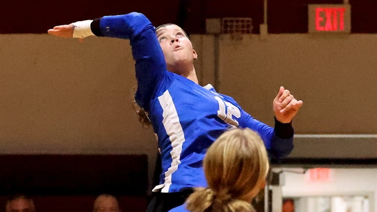 Shelter Island's Sophie Clark returns the Ross volley in the...