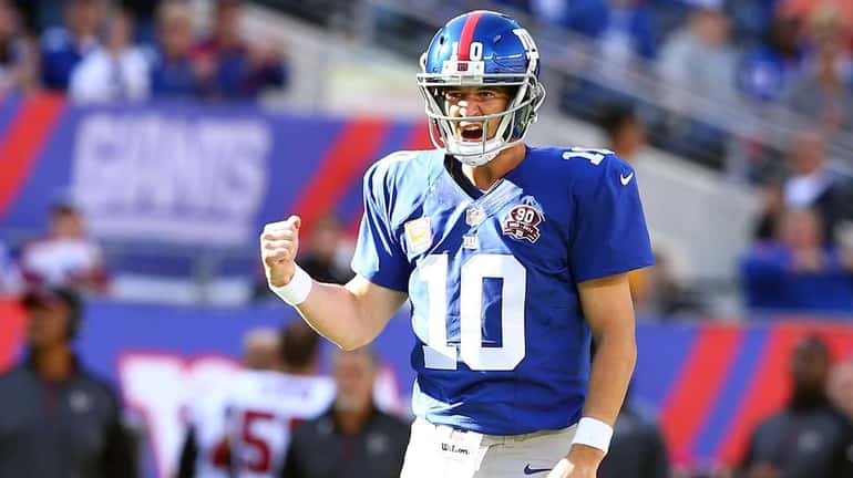 Eli Manning celebrates a play in the fourth quarter of...