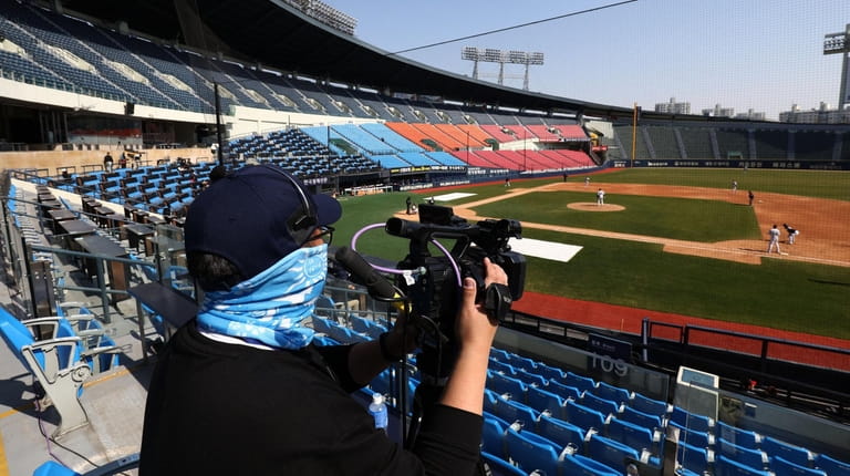 Employees of LG Twins broadcast their intra-team game played for...