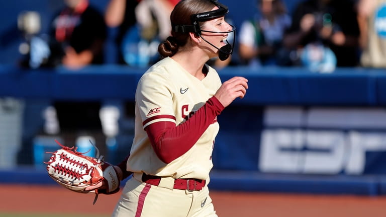 Florida State pitcher Kathryn Sandercock celebrates after a strikeout against...