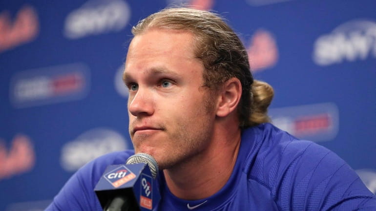 New York Mets starting pitcher Noah Syndergaard answers questions during...
